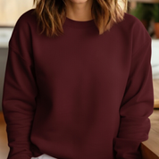 Person wearing a maroon sweatshirt indoors