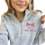Brooke District Unisex 1/4 Zip Sweatshirt | Bow Embroidery